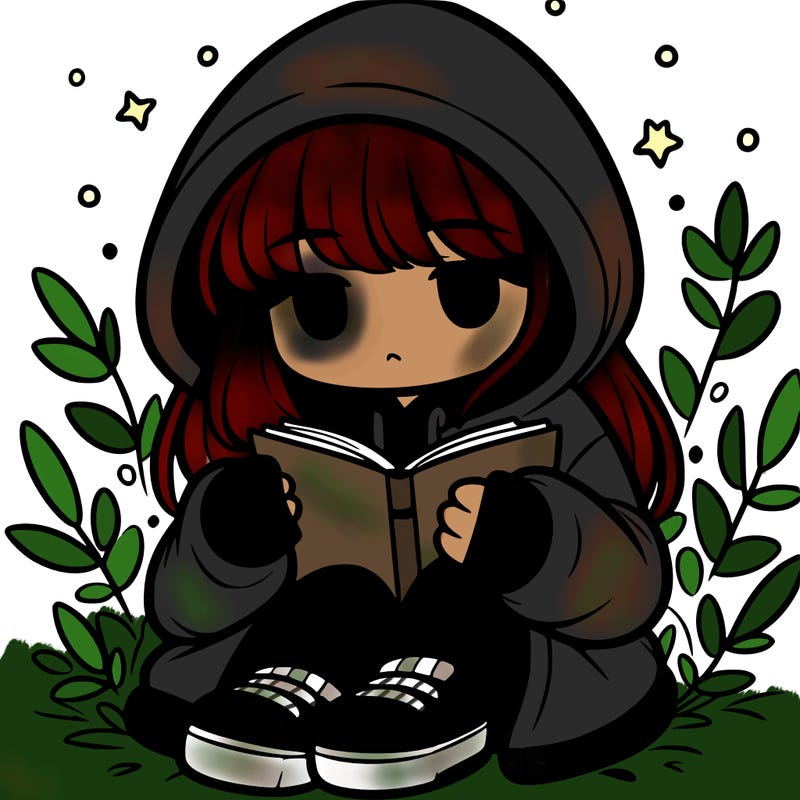 girl in oversized hoodie reading a book