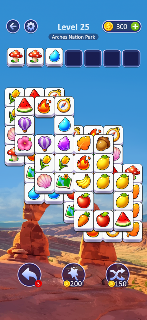 Tile Vacation - Triple Match - Una captura de pantalla de la jugabilidad de Tile Vacation Triple Match que muestra un tablero de puzle de fichas ambientado contra un paisaje desértico del Parque Nacional Arches.