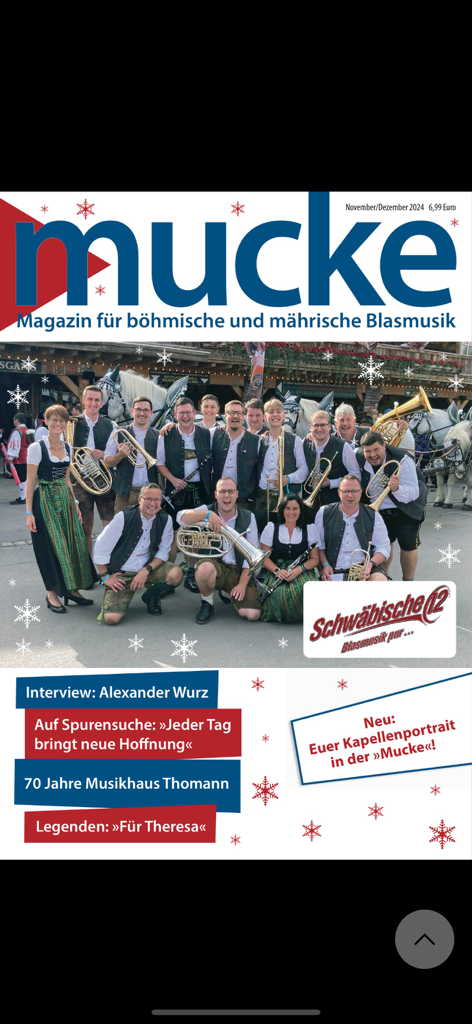 Mucke - Cover of Mucke magazine featuring the Schwaebische 12 brass band in traditional German attire holding instruments
