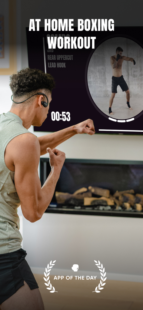 PunchLab: Boxing Workout - A man shadowboxing at home while following a coach led session on a large TV screen