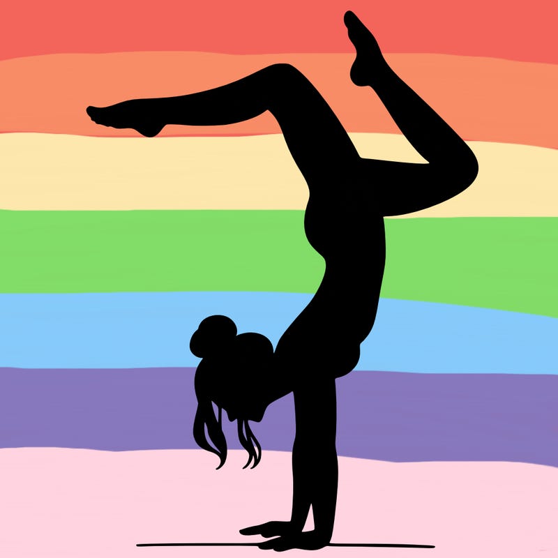 a woman doing a handstand