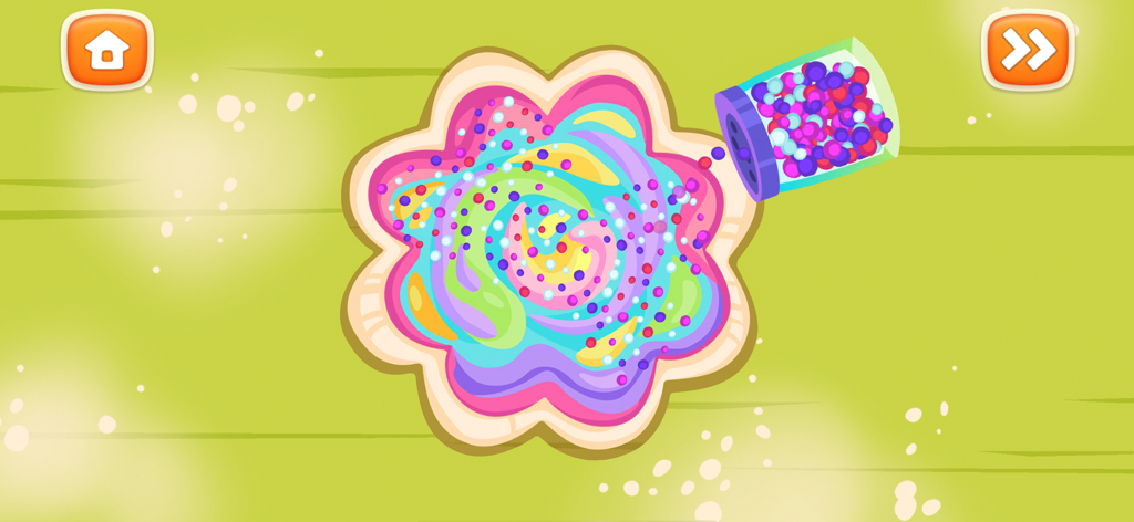 Pizza Maker: Kids Cooking Game - A flower shaped candy pizza with colorful frosting being decorated with sprinkles in a kids cooking game