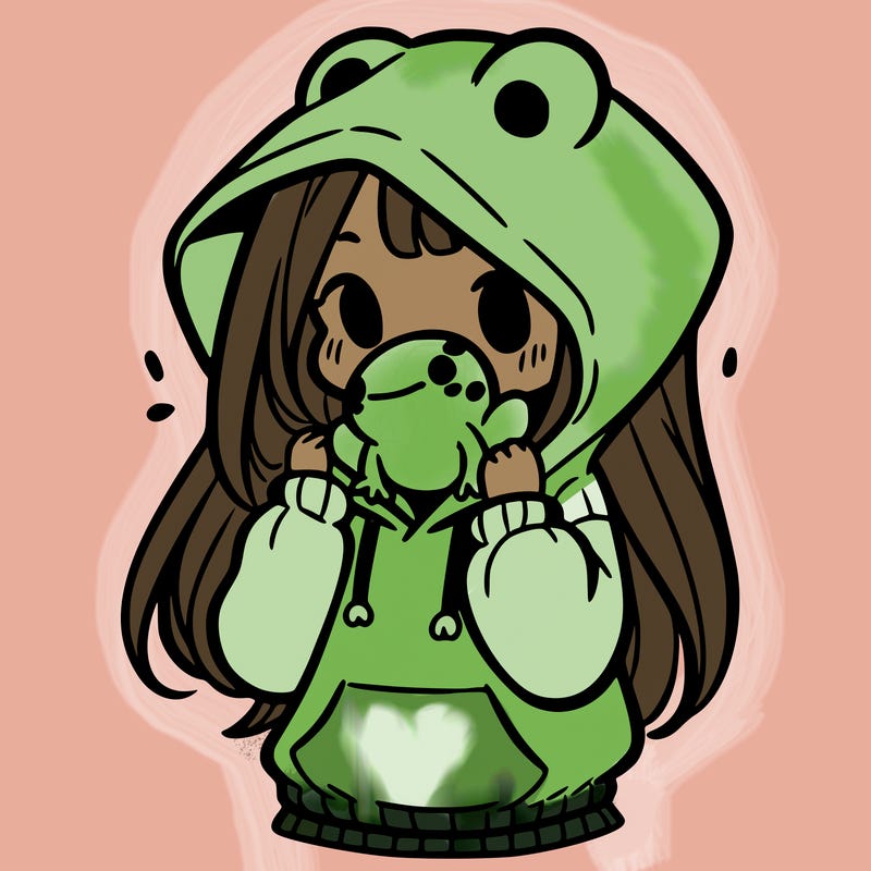 a girl holding a froggy hoodie