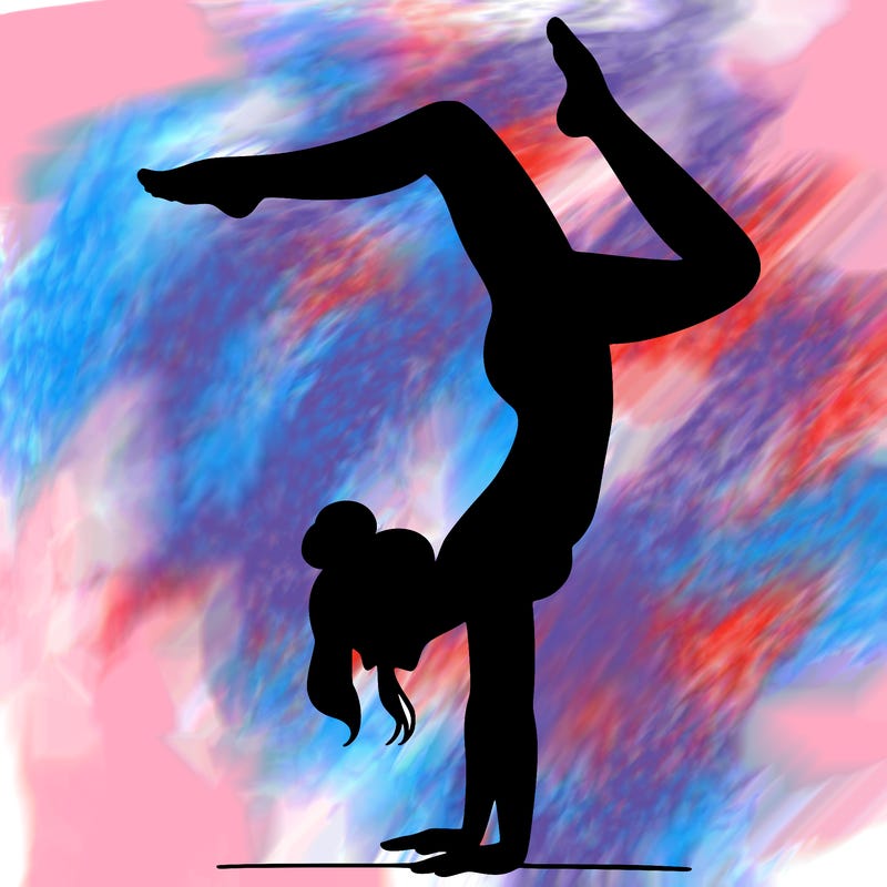 a woman doing a handstand