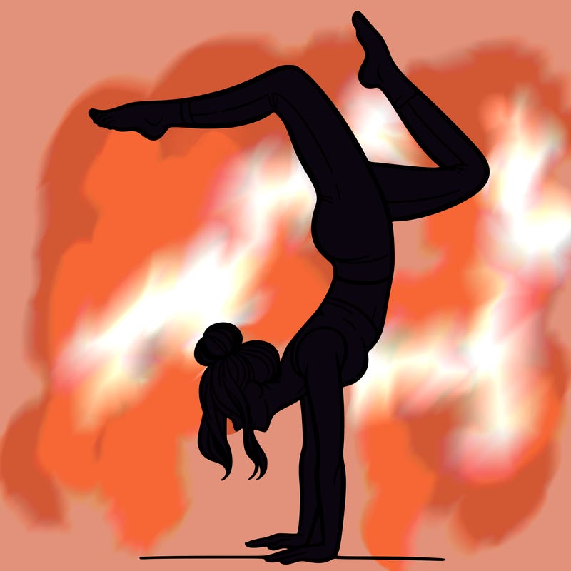 a woman doing a handstand