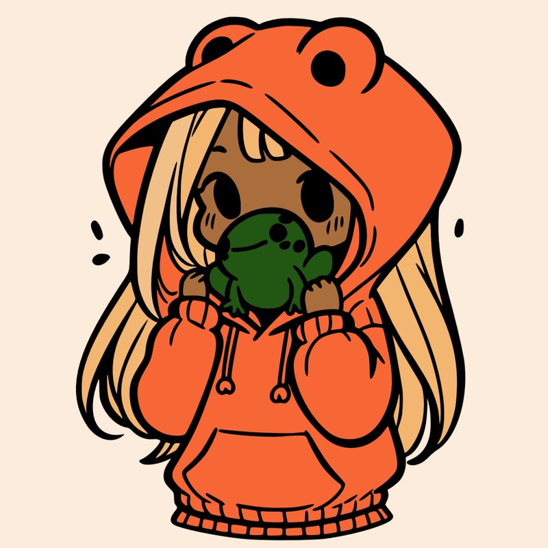 a girl holding a froggy hoodie