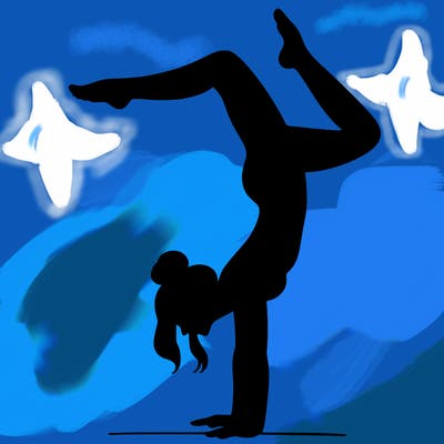 a woman doing a handstand