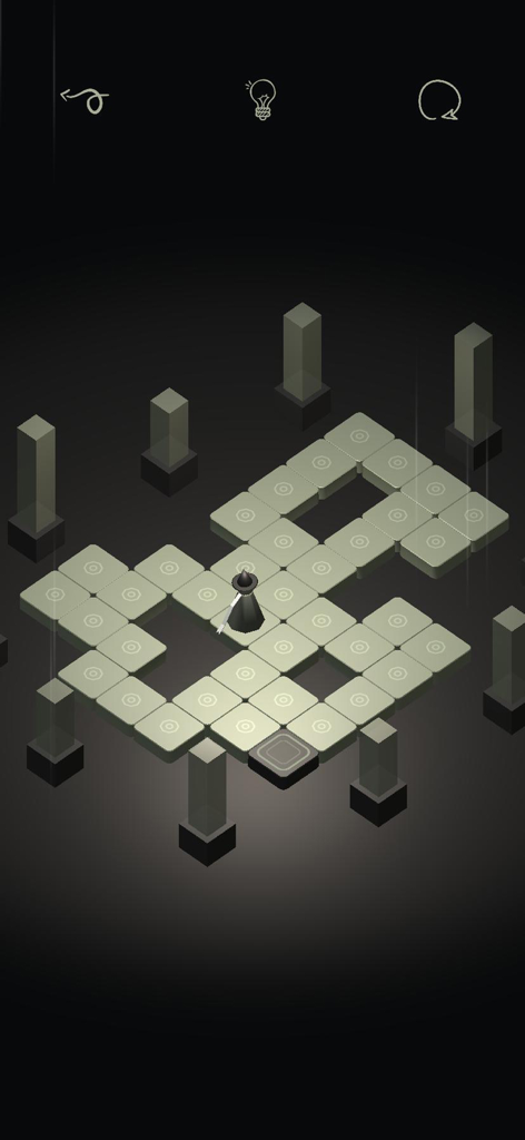Spellbound Valley - A small wizard character standing on a tile path within a dark isometric puzzle level
