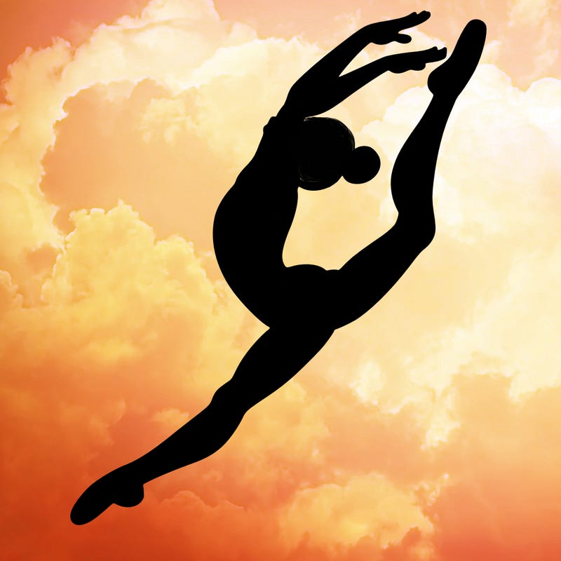 gymnast doing a leap in a leotard with a bent back leg