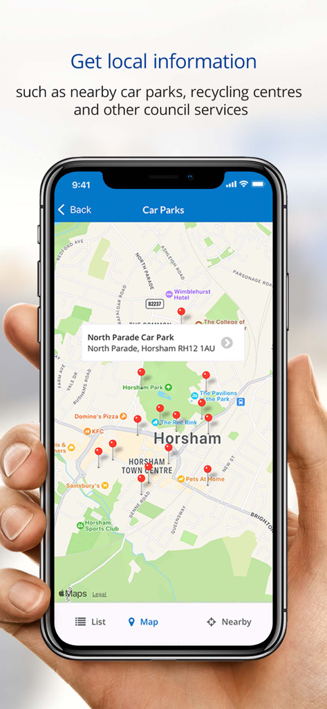 A smartphone screen showing a map of Horsham with pins for local car parks in the Horsham District Council app.