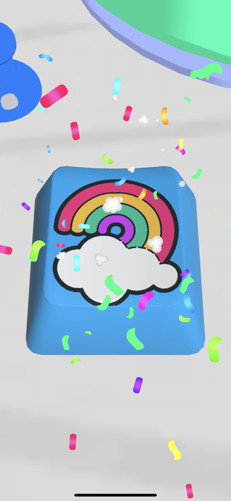Custom blue keycap with a rainbow and cloud design and falling confetti