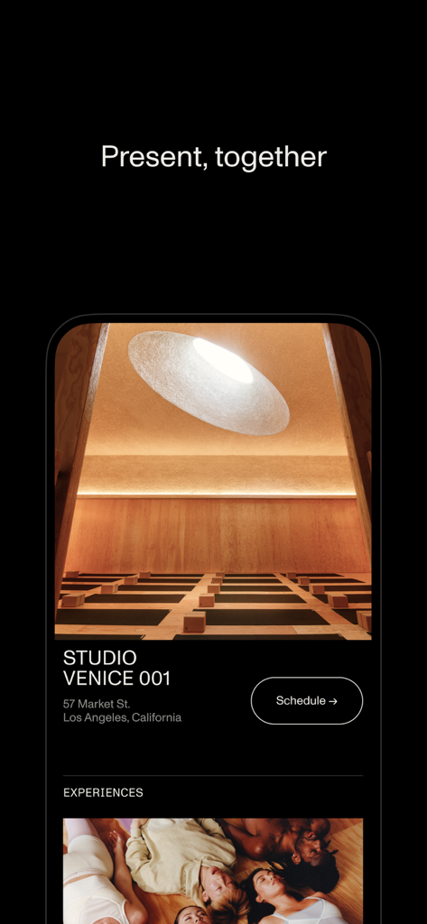 Open app interface showing the Venice studio location with minimalist wood interior and circular skylight