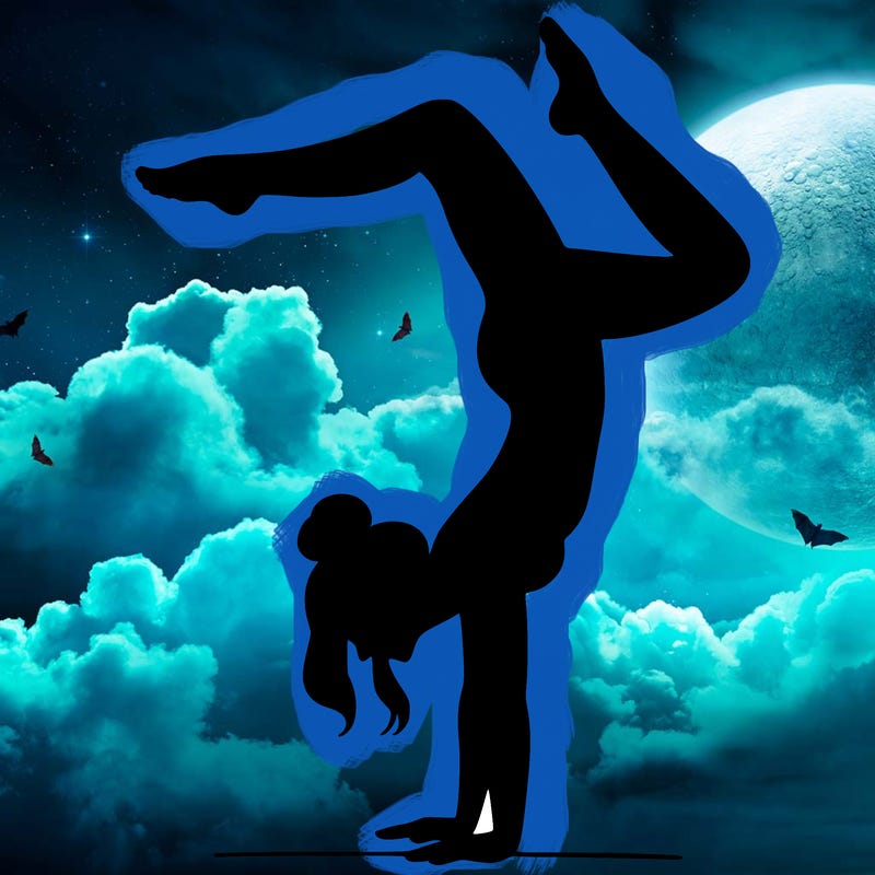 a woman doing a handstand