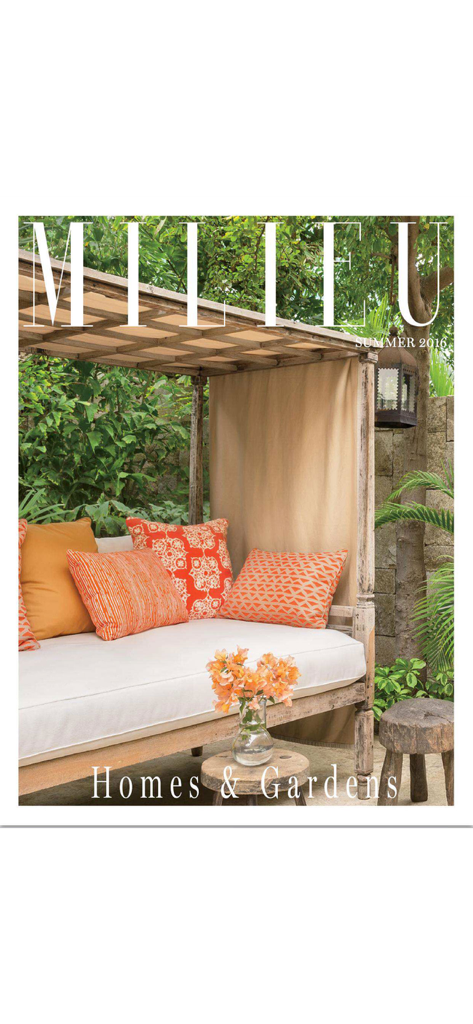 MILIEU Magazine - MILIEU Magazine cover featuring a luxury outdoor daybed with orange accent pillows in a lush garden setting