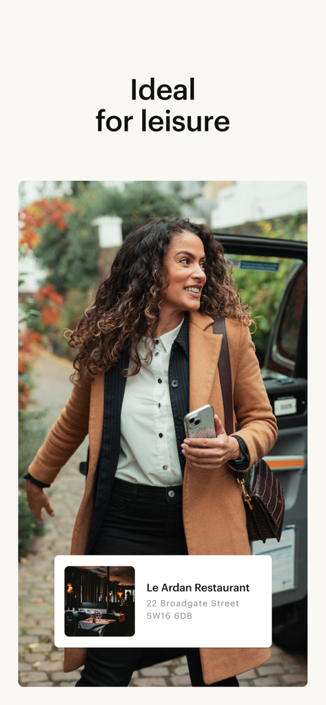 A woman arriving at a restaurant in a London black taxi for a leisure trip.