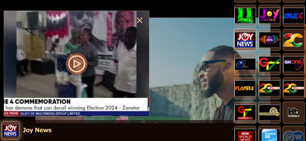 Interfaccia dell'app 2CTV che mostra una trasmissione in diretta di Joy News e una griglia di canali TV africani