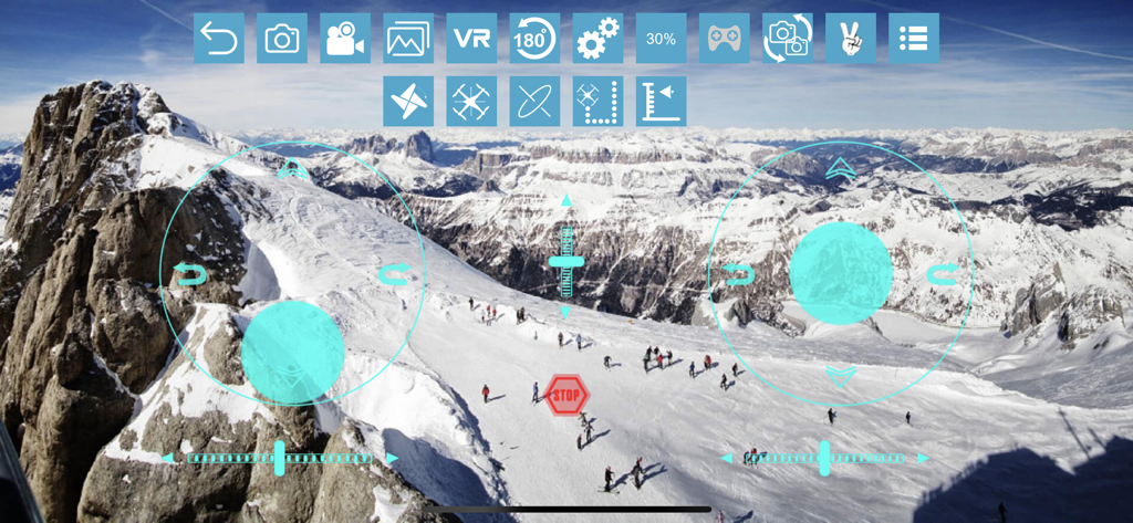 RCFPVPro - FPV drone view of snowy mountains with virtual joystick controls in RCFPVPro app.