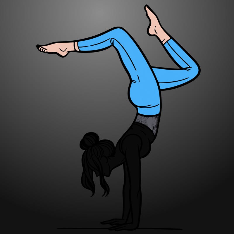 a woman doing a handstand