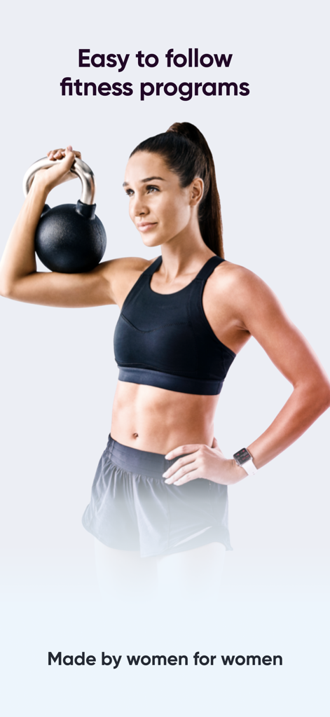 Woman holding a kettlebell for a fitness program made by women for women