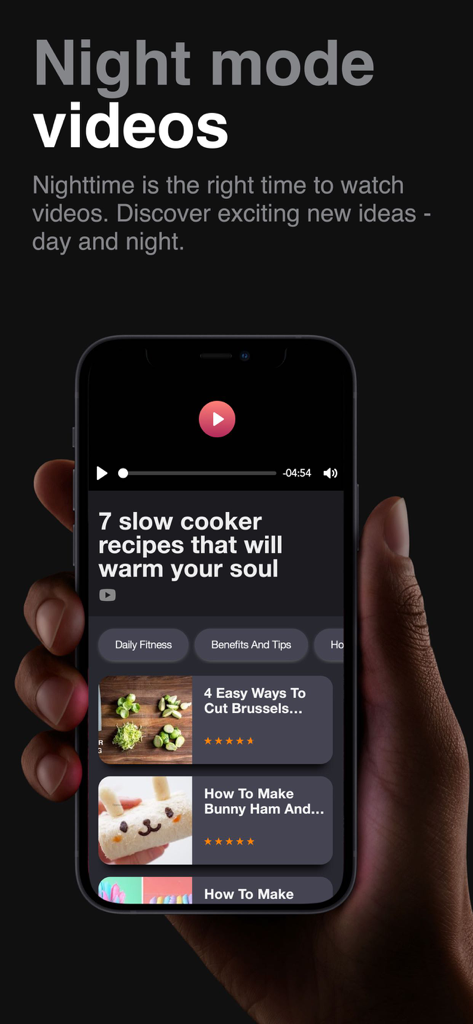 Dumbbell Home Workout Trainer - Smartphone displaying the night mode video feature with fitness and nutrition tutorials