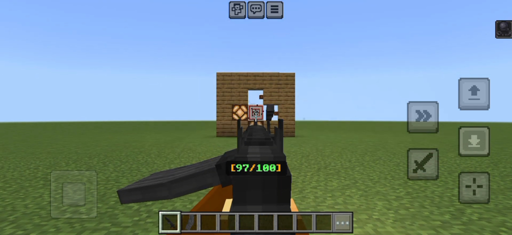 Gun Addons for Minecraft - Vista en primera persona de un jugador apuntando un rifle de asalto negro a un objetivo en Minecraft con un contador de munición