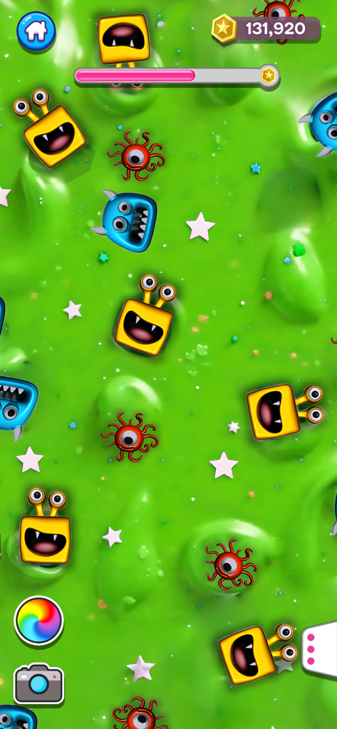 Gameplay screenshot of Super Slime Simulator showing green slime decorated with colorful monster icons and stars