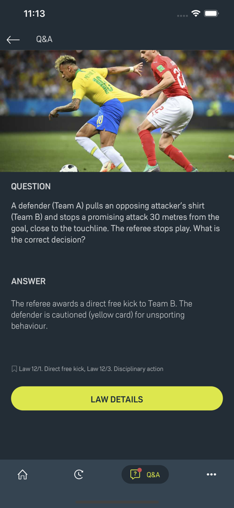 Laws of the Game - A Q&A screen from the IFAB Laws of the Game app explaining the referee decision for a shirt pulling foul
