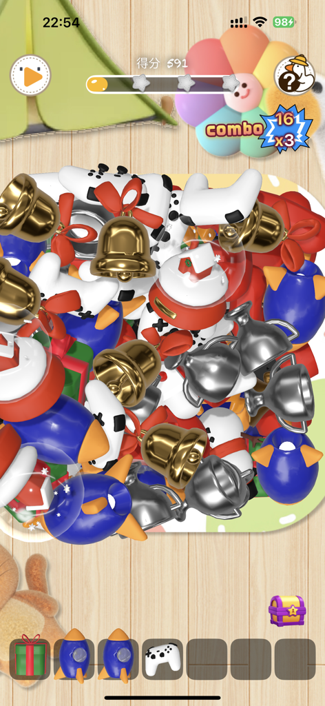 TallDaEr - Gameplay screen of TallDaEr showing a 3D match-3 puzzle with various items like golden bells and silver trophies