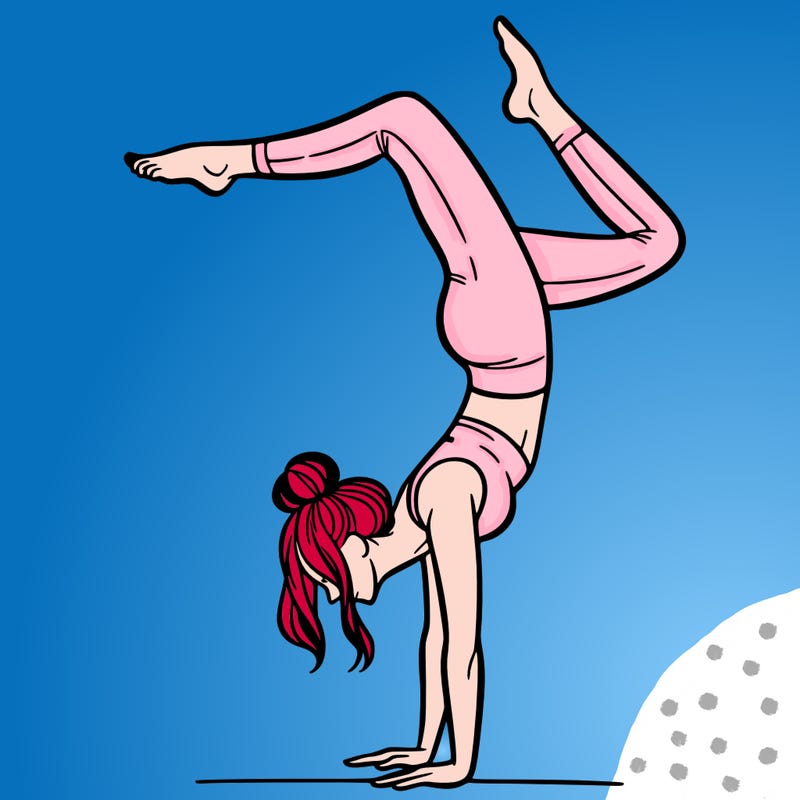 a woman doing a handstand