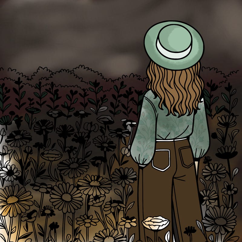 a woman in a field of flowers