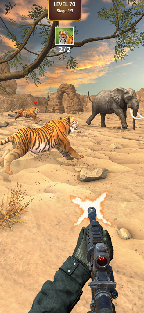 Ego-Shooter-Ansicht eines Scharfschützengewehrs, das auf Tiger und einen Elefanten in einer Wüsten-Schlucht-Umgebung feuert