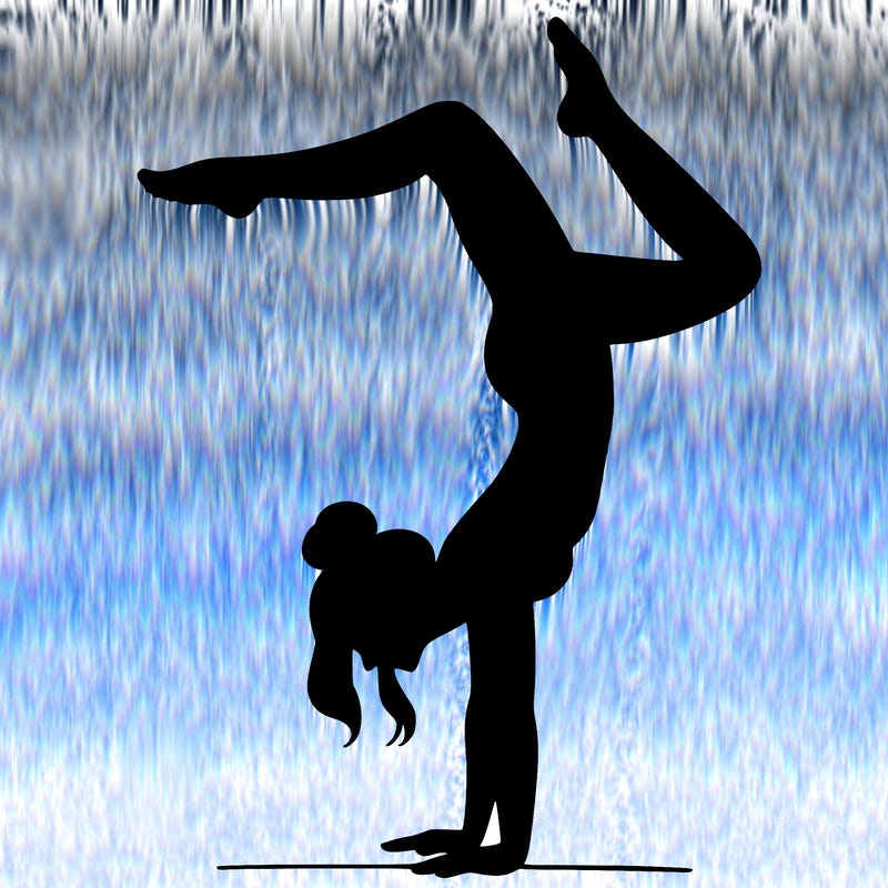 a woman doing a handstand