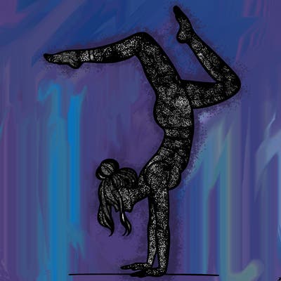 a woman doing a handstand