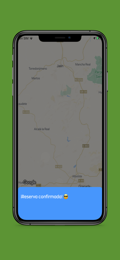 Radio Taxi Jaen - Una pantalla de smartphone que muestra un mensaje de confirmación de reserva de taxi sobre un mapa de Jaén, España, en la aplicación Radio Taxi Jaen.