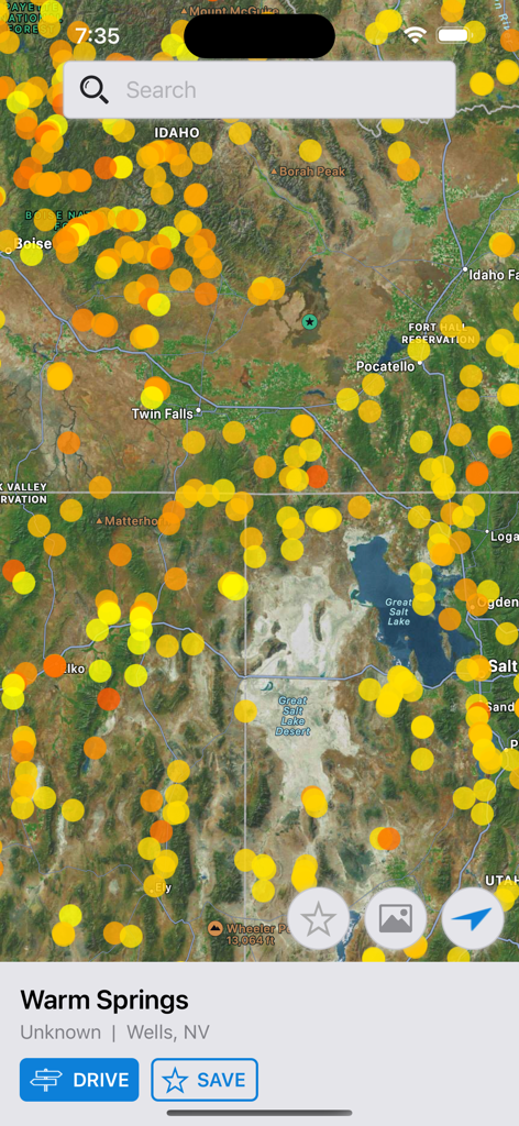 US Hot Springs - Satellite map view of the US Hot Springs app showing numerous spring locations across Idaho and Nevada with a search bar and navigation buttons.