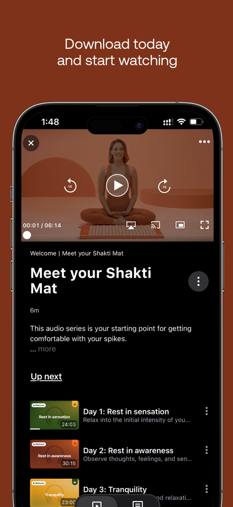 Shakti Shala - Smartphone screen displaying a video lesson from the Shakti Shala app titled Meet your Shakti Mat.