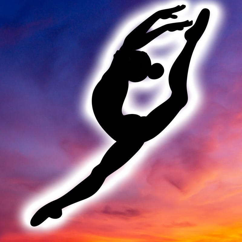 gymnast doing a leap in a leotard with a bent back leg