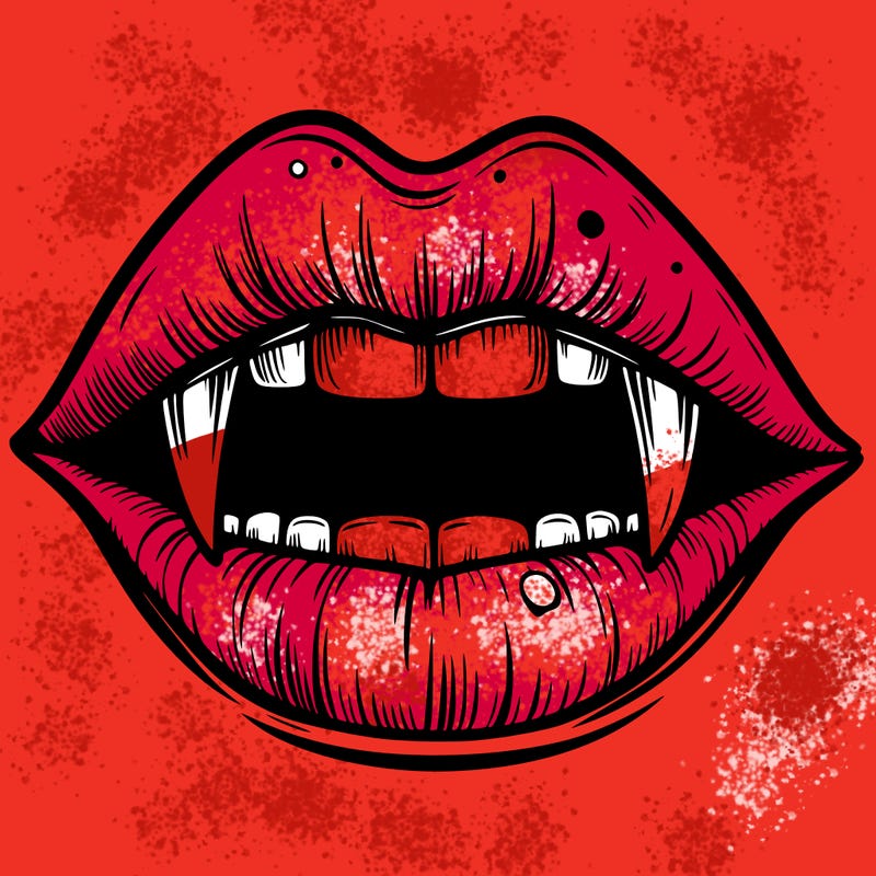 lips with vampire teeth