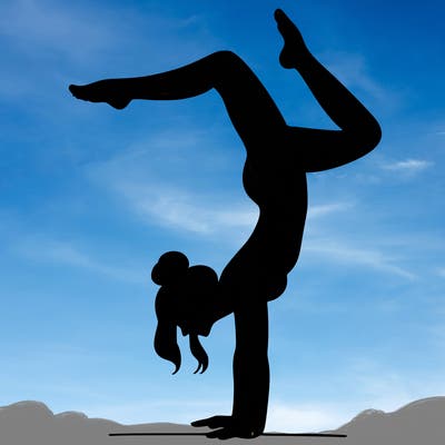 a woman doing a handstand