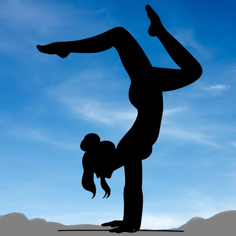 a woman doing a handstand