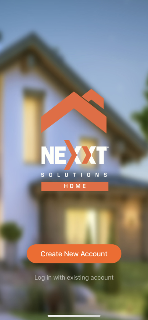 Nexxt Home - Nexxt Homeアプリのログイン画面。会社ロゴとオレンジ色の「新規アカウント作成」ボタンが表示されている。