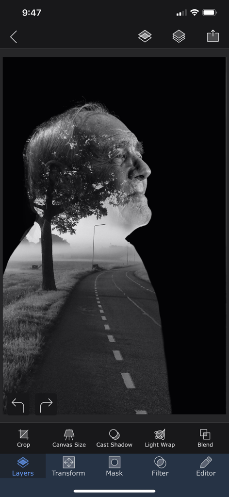 Superimpose X - A black and white double exposure effect of an elderly man's profile combined with a misty road landscape being edited in the Superimpose X app.