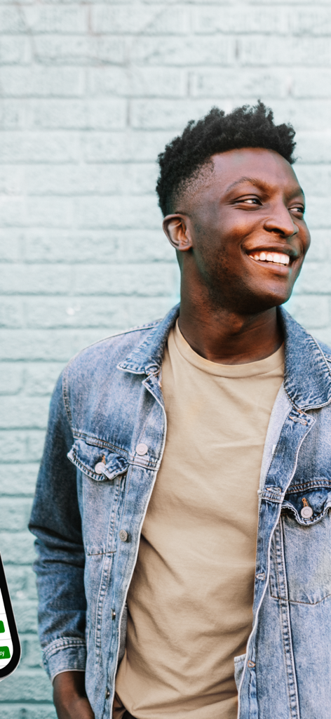 TD Easy Trade - A smiling young man in a denim jacket representing the Gen Z and Millennial target audience of the TD Easy Trade app
