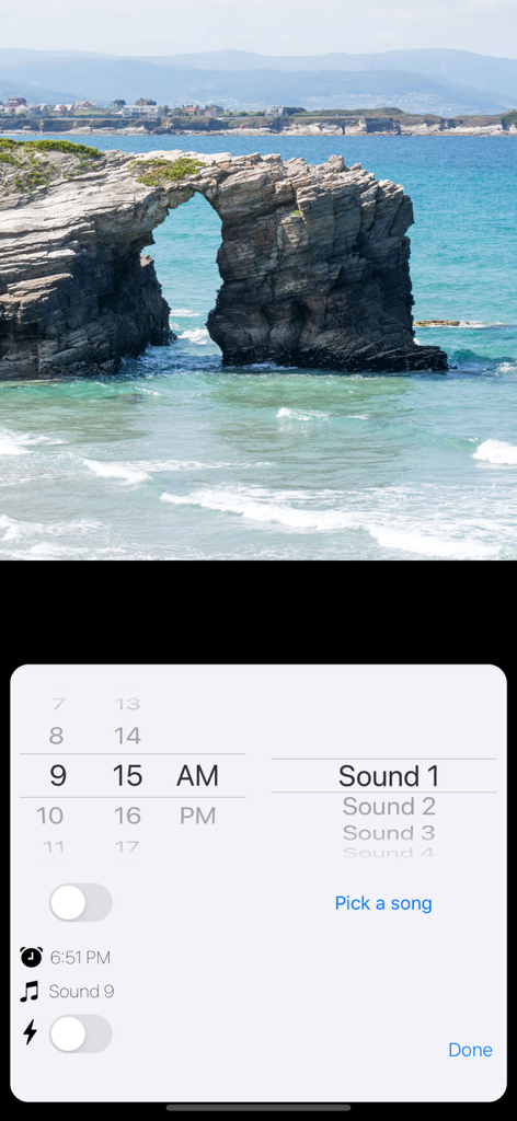 Standby Alarm Clock - Alarm clock configuration interface with time and sound options over a scenic background