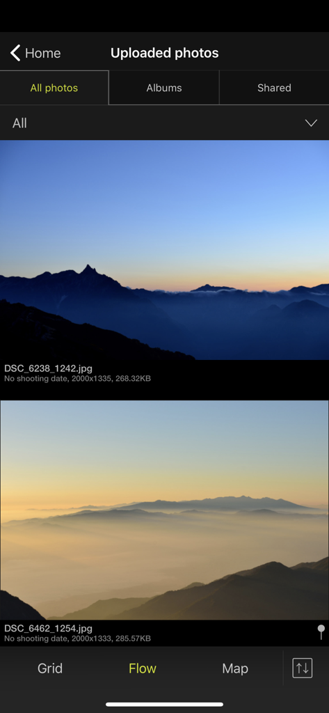 Une capture d'écran de l'application Nikon Image Space affichant des photos de paysages de montagne téléchargées dans une disposition de flux vertical.