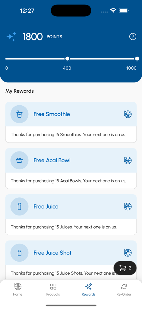 Body Energy Club Canada - Pantalla de recompensas de Body Energy Club Canada que muestra un saldo de 1800 puntos de fidelidad y ofertas canjeables por batidos y tazones de açaí gratis.