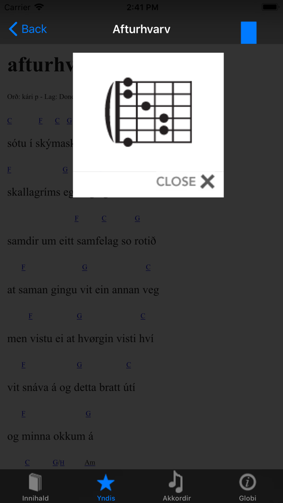 Okkara Sangbók - A guitar chord diagram pop up over Faroese song lyrics in the Okkara Sangbok app