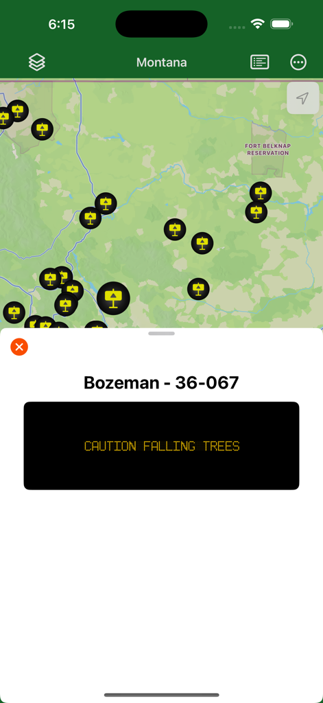 Montana Traveler app map showing a caution alert for falling trees in the Bozeman area