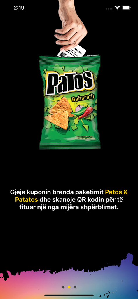 Hand pulling a reward coupon with a QR code from a bag of Patos chips.