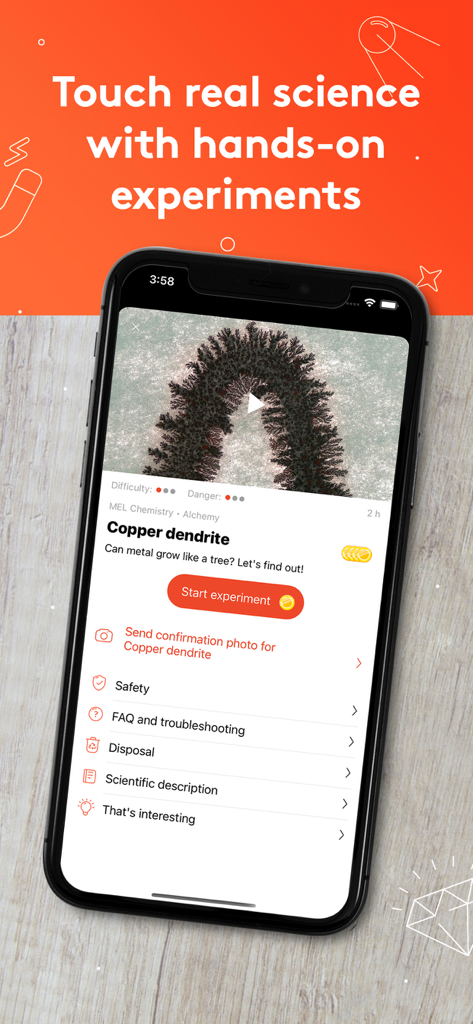 Pantalla de smartphone que muestra la aplicación MEL Science con una guía de experimento de química de dendritas de cobre.